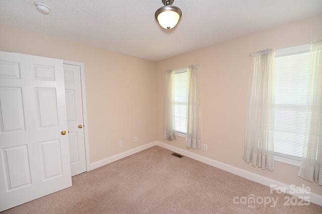 202 Pine Meadows St, Hickory, NC 28601 - carpeted spare room with a textured ceiling