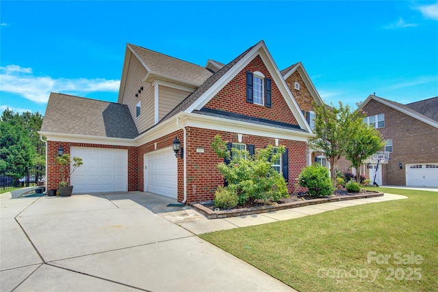 2805 Julian Glen Cir, Waxhaw, NC 28173 - traditional home with an attached garage, brick siding, concrete driveway, a front lawn, and a shingled roof