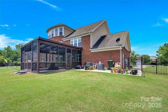 2805 Julian Glen Cir, Waxhaw, NC 28173 - back of property featuring a sunroom, brick siding, a patio area, and a shingled roof