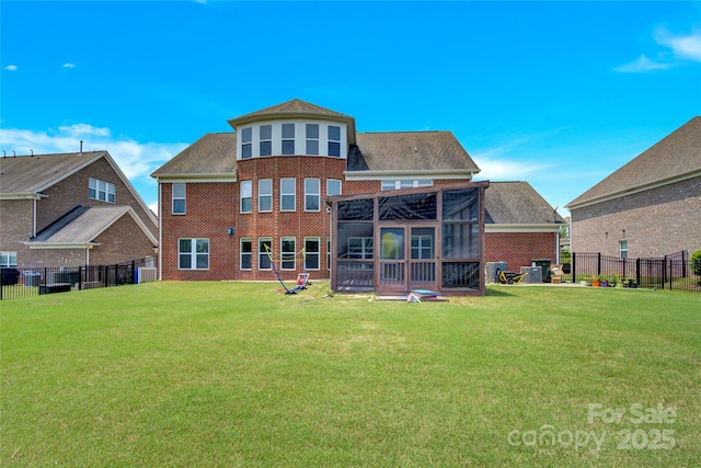 2805 Julian Glen Cir, Waxhaw, NC 28173 - rear view of house featuring a sunroom, brick siding, and roof with shingles