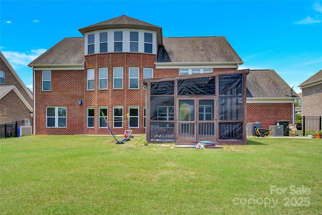 2805 Julian Glen Cir, Waxhaw, NC 28173 - back of house with a sunroom, brick siding, and roof with shingles