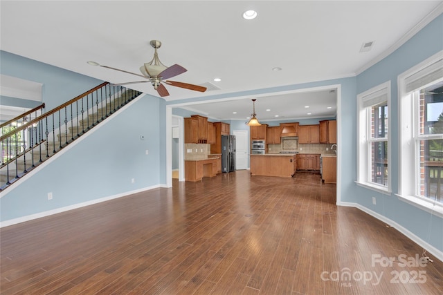 2805 Julian Glen Cir, Waxhaw, NC 28173 - unfurnished living room featuring a ceiling fan, healthy amount of natural light, dark wood-style flooring, stairs, and recessed lighting