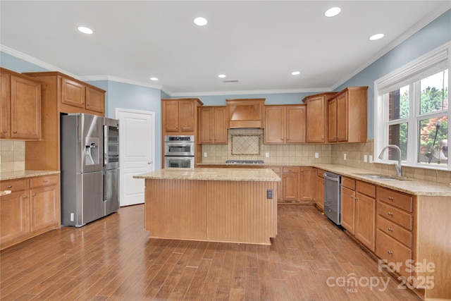 2805 Julian Glen Cir, Waxhaw, NC 28173 - kitchen featuring stainless steel appliances, custom range hood, light stone countertops, tasteful backsplash, and ornamental molding