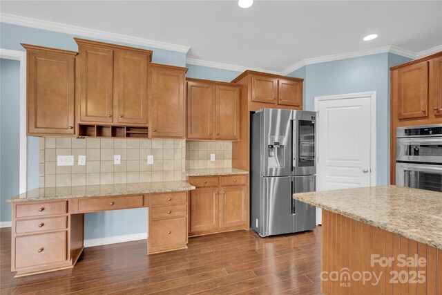2805 Julian Glen Cir, Waxhaw, NC 28173 - kitchen with appliances with stainless steel finishes, dark wood finished floors, crown molding, light stone countertops, and tasteful backsplash