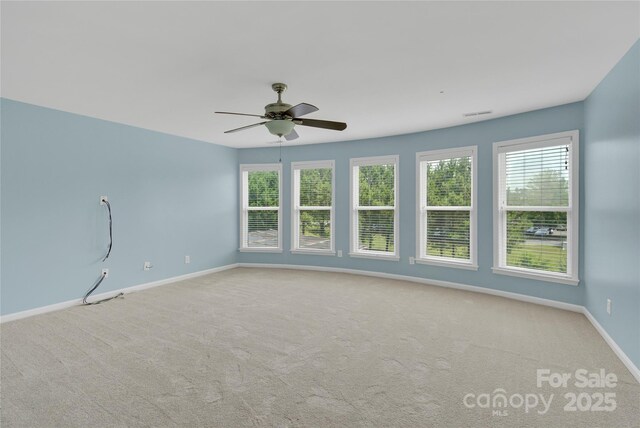 2805 Julian Glen Cir, Waxhaw, NC 28173 - carpeted empty room with healthy amount of natural light and a ceiling fan