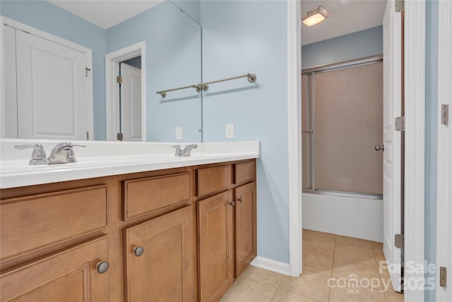 2805 Julian Glen Cir, Waxhaw, NC 28173 - full bath featuring double vanity, combined bath / shower with glass door, and tile patterned floors