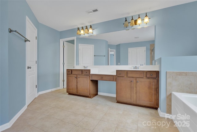 2805 Julian Glen Cir, Waxhaw, NC 28173 - full bathroom with double vanity, a garden tub, tile patterned flooring, and a chandelier