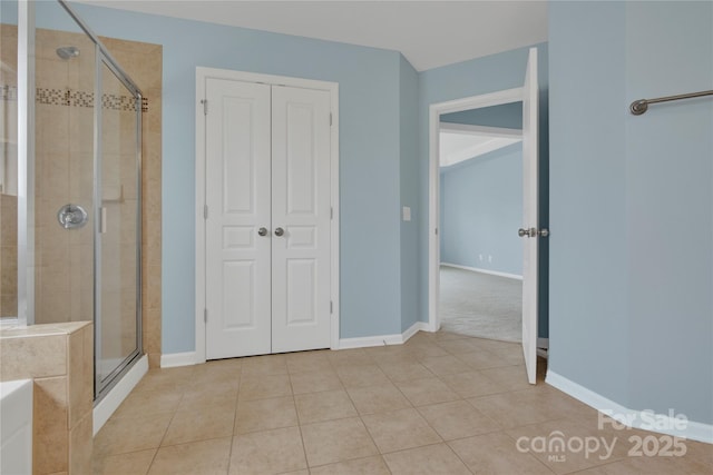 2805 Julian Glen Cir, Waxhaw, NC 28173 - bathroom with a stall shower, a bath, and tile patterned floors