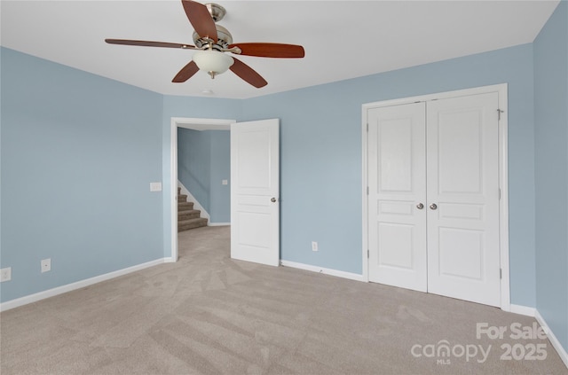 2805 Julian Glen Cir, Waxhaw, NC 28173 - unfurnished bedroom with carpet flooring, a closet, and ceiling fan