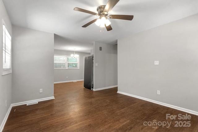 6101 Mcgregor Dr, Charlotte, NC 28227 - spare room featuring a ceiling fan, a chandelier, and dark wood finished floors