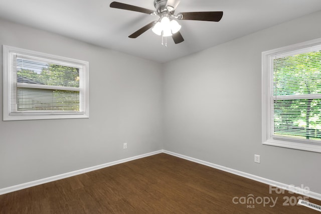 6101 Mcgregor Dr, Charlotte, NC 28227 - unfurnished room with dark wood finished floors, plenty of natural light, and a ceiling fan