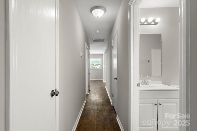 6101 Mcgregor Dr, Charlotte, NC 28227 - hallway with a sink and dark wood-style floors