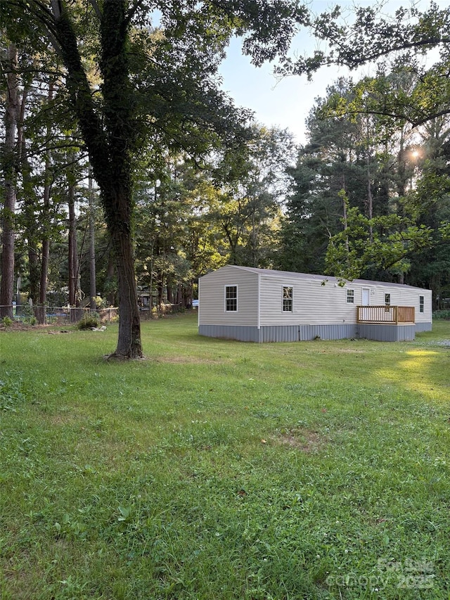 114 Woodberry Dr, Cherryville, NC 28021 - view of grassy yard featuring view of scattered trees and a deck