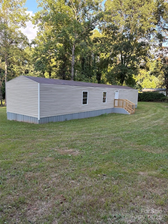 114 Woodberry Dr, Cherryville, NC 28021 - view of side of home featuring a yard and view of scattered trees