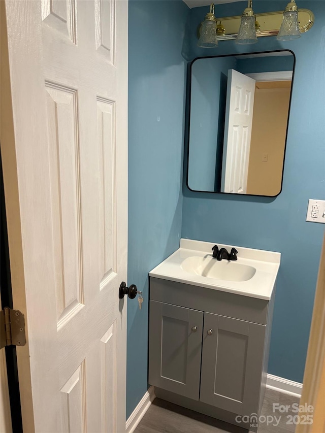114 Woodberry Dr, Cherryville, NC 28021 - bathroom with vanity and wood finished floors