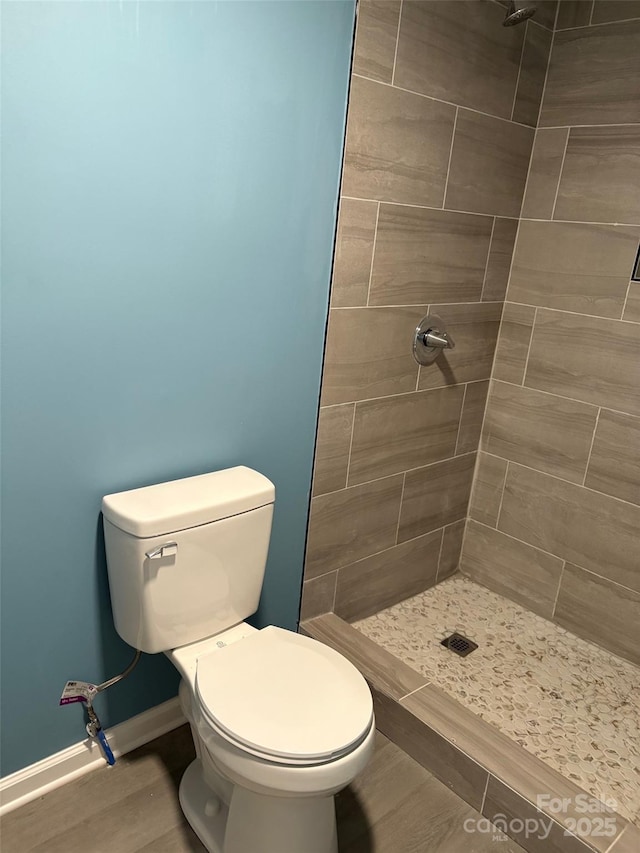 114 Woodberry Dr, Cherryville, NC 28021 - bathroom featuring a tile shower and toilet
