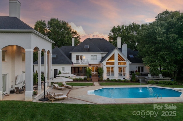533 Valley Run Dr, Waxhaw, NC 28173 - rear view of house featuring a patio, a yard, and a chimney