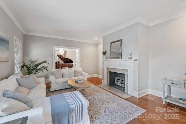 533 Valley Run Dr, Waxhaw, NC 28173 - living area featuring wood finished floors, crown molding, and a premium fireplace