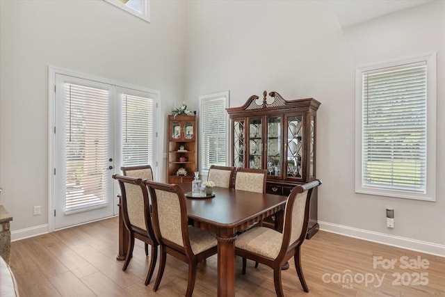 533 Valley Run Dr, Waxhaw, NC 28173 - dining room with light wood finished floors, healthy amount of natural light, and a towering ceiling