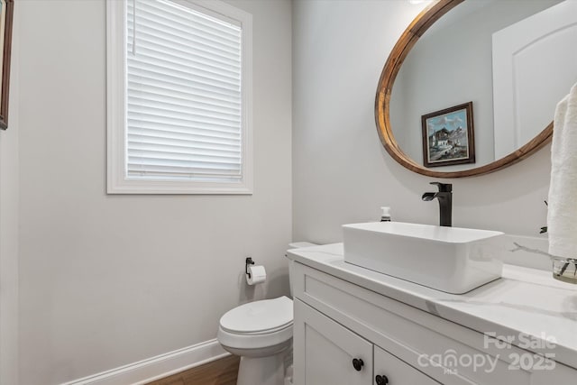 533 Valley Run Dr, Waxhaw, NC 28173 - half bathroom with vanity and wood finished floors