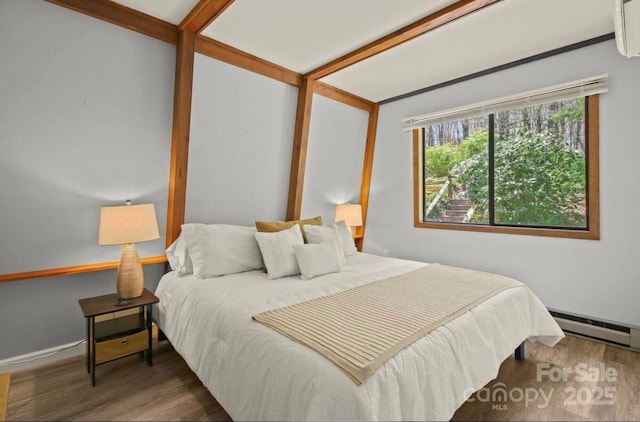 26 Pinetop Cir Unit B, Banner Elk, NC 28604 - bedroom featuring wood finished floors and a baseboard heating unit
