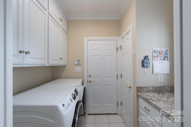 971 Blakeley Walk, Rock Hill, SC 29732 - laundry area with cabinet space, washing machine and clothes dryer, ornamental molding, and light tile patterned floors
