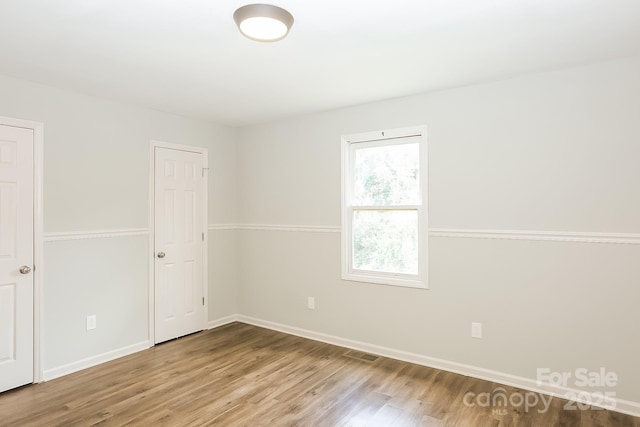 8079 Optimist Club Rd, Denver, NC 28037 - unfurnished room featuring wood finished floors and baseboards