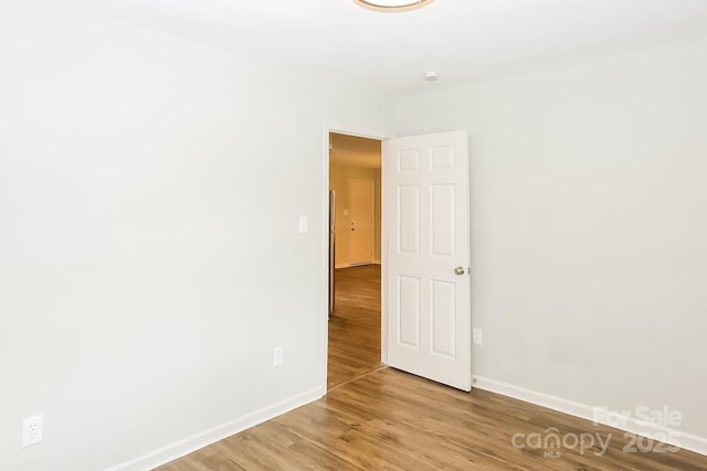 8079 Optimist Club Rd, Denver, NC 28037 - empty room featuring baseboards and wood finished floors