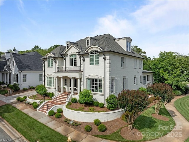 2990 Reynolds Sq, Winston Salem, NC 27106 - french country inspired facade featuring a balcony and brick siding