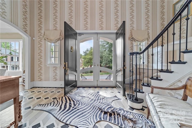 2990 Reynolds Sq, Winston Salem, NC 27106 - entryway with french doors, wallpapered walls, wood finished floors, and stairs