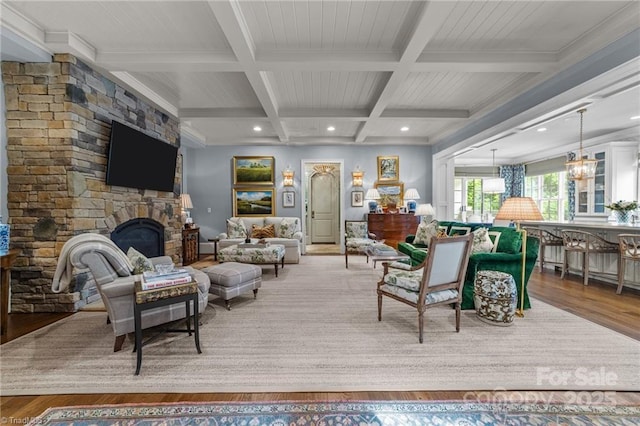 2990 Reynolds Sq, Winston Salem, NC 27106 - living area featuring beamed ceiling, coffered ceiling, a fireplace, wood finished floors, and crown molding