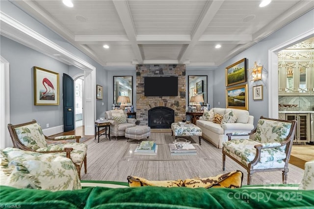 2990 Reynolds Sq, Winston Salem, NC 27106 - living room featuring beverage cooler, beam ceiling, wood finished floors, recessed lighting, and a stone fireplace