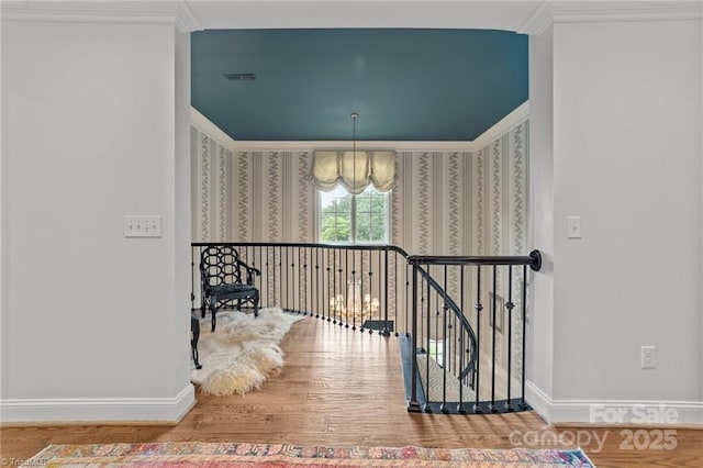 2990 Reynolds Sq, Winston Salem, NC 27106 - stairway featuring wood finished floors, crown molding, and a chandelier