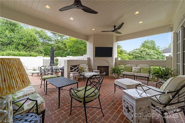 2990 Reynolds Sq, Winston Salem, NC 27106 - view of patio / terrace featuring an outdoor living space with a fireplace and a ceiling fan