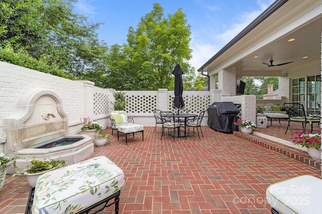 2990 Reynolds Sq, Winston Salem, NC 27106 - view of patio with area for grilling, a ceiling fan, and outdoor dining space