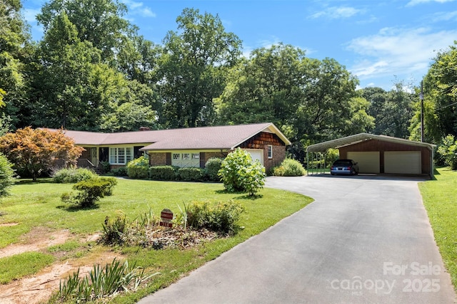 218 Rose St, Mount Holly, NC 28120 - view of front of home with a front yard, driveway, and a chimney