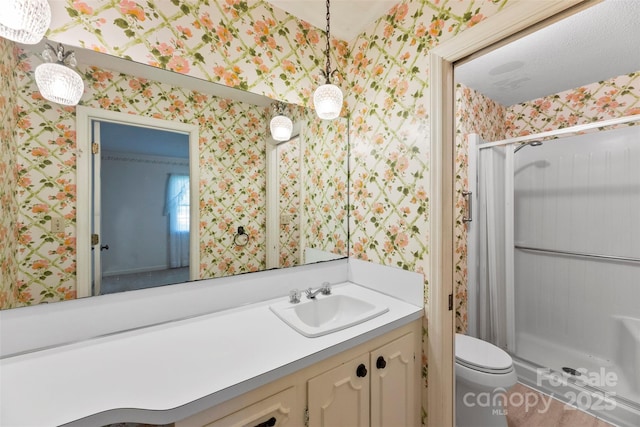 218 Rose St, Mount Holly, NC 28120 - bathroom featuring wallpapered walls, a shower stall, and vanity
