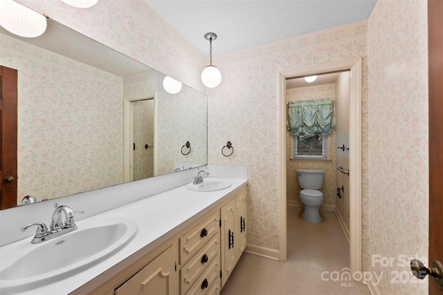 218 Rose St, Mount Holly, NC 28120 - full bath with wallpapered walls, double vanity, and a textured ceiling