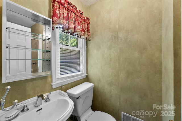 218 Rose St, Mount Holly, NC 28120 - half bathroom with toilet and a sink