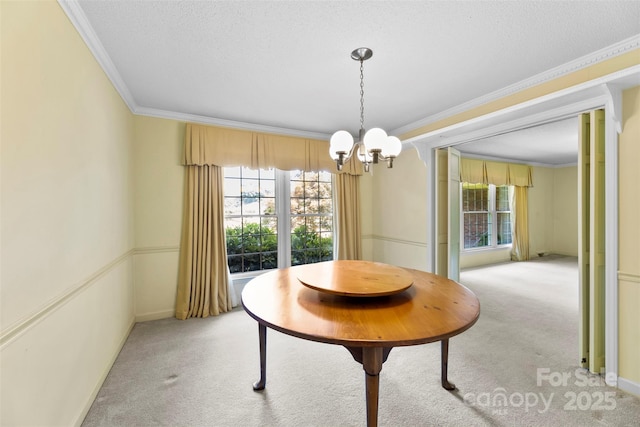 218 Rose St, Mount Holly, NC 28120 - dining space with a chandelier, light colored carpet, crown molding, and a textured ceiling