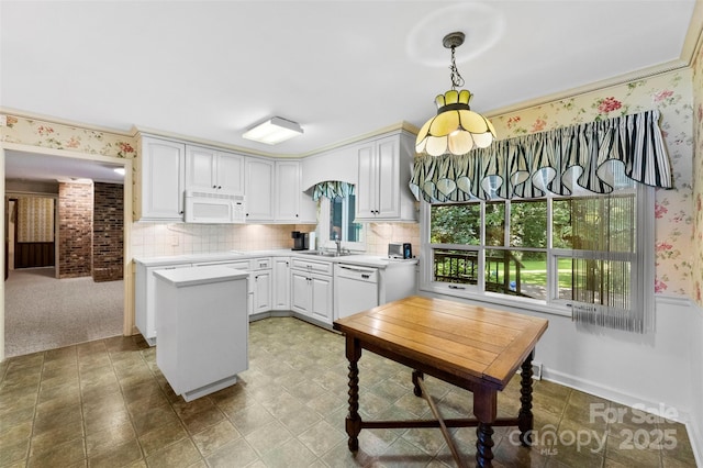 218 Rose St, Mount Holly, NC 28120 - kitchen with white appliances, light countertops, a center island, tasteful backsplash, and wallpapered walls