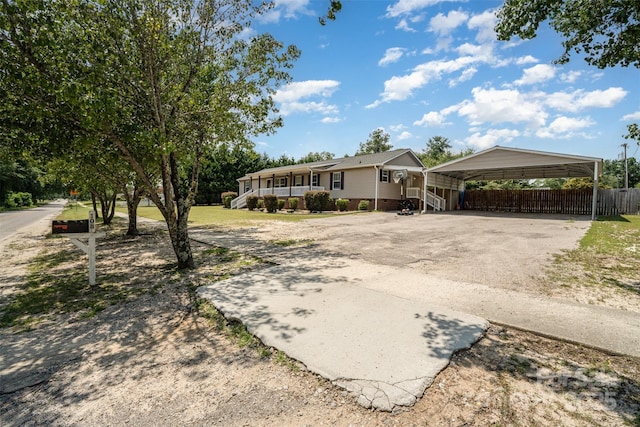 108 W Welsh St, Kershaw, SC 29067 - view of front facade with driveway, a carport, and a porch