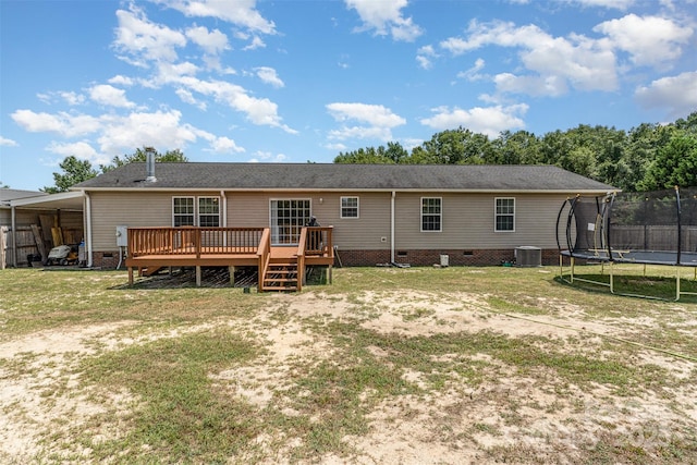 108 W Welsh St, Kershaw, SC 29067 - back of house featuring a trampoline, crawl space, a deck, and a lawn