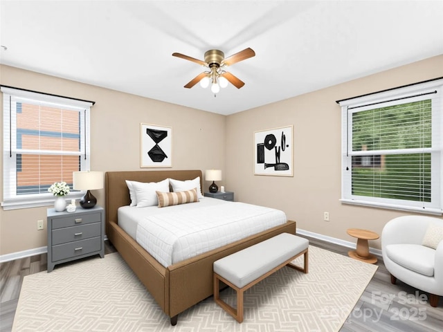 1745 Haywood Manor Rd Unit A, Hendersonville, NC 28791 - bedroom with wood finished floors, multiple windows, and a ceiling fan