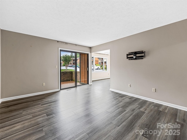 1745 Haywood Manor Rd Unit A, Hendersonville, NC 28791 - empty room with dark wood finished floors and a textured ceiling