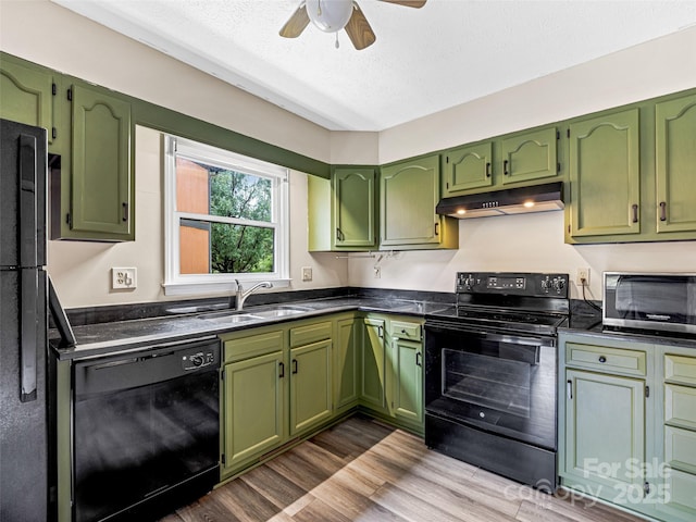 1745 Haywood Manor Rd Unit A, Hendersonville, NC 28791 - kitchen featuring black appliances, green cabinetry, under cabinet range hood, a ceiling fan, and dark countertops