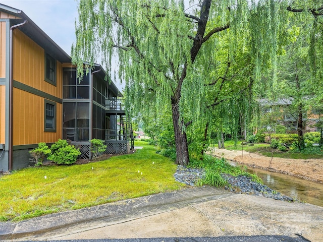 1745 Haywood Manor Rd Unit A, Hendersonville, NC 28791 - view of green lawn with a sunroom