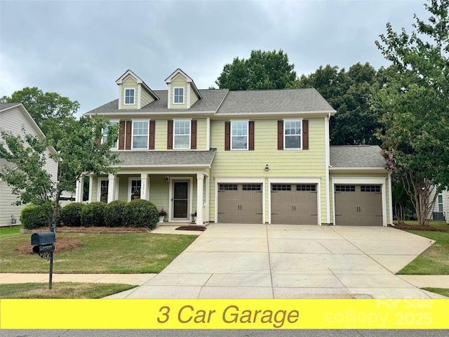 12517 Pine Terrace Ct, Charlotte, NC 28273 - view of front facade featuring driveway, a front yard, a porch, an attached garage, and a shingled roof