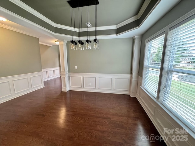 12517 Pine Terrace Ct, Charlotte, NC 28273 - unfurnished room with ornate columns, a raised ceiling, ornamental molding, dark wood-style floors, and a decorative wall