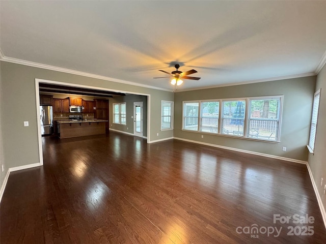 12517 Pine Terrace Ct, Charlotte, NC 28273 - unfurnished living room with ceiling fan, dark wood-type flooring, ornamental molding, and plenty of natural light